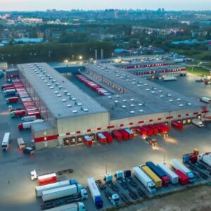 Distribution warehouse with trucks and loading bays